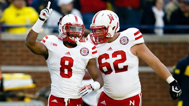 Ameer Abdullah and Cole Pensick 2013 Nebraska at Michigan football USATSI_7542612